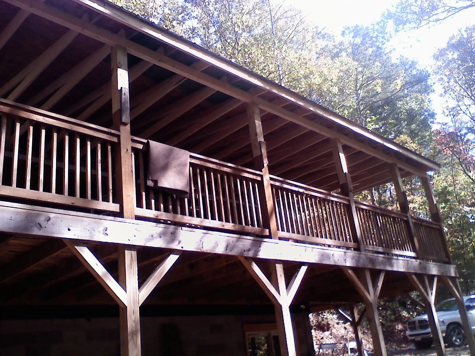 Timber framing under a new elevated porch and deck — Roof Leak Repair in Hostetter by Roofing Brothers